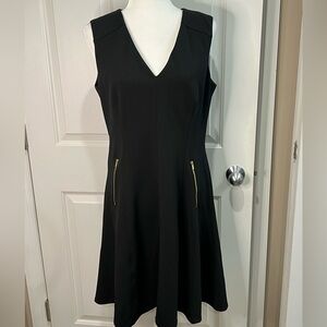 Black V neck fit and flare career dress by Calvin Klein with accent zippers 10